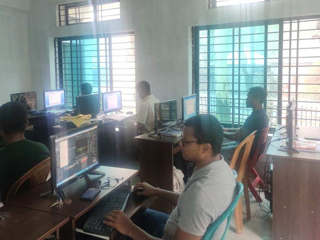 Young people training at computers in an OfP skills lab